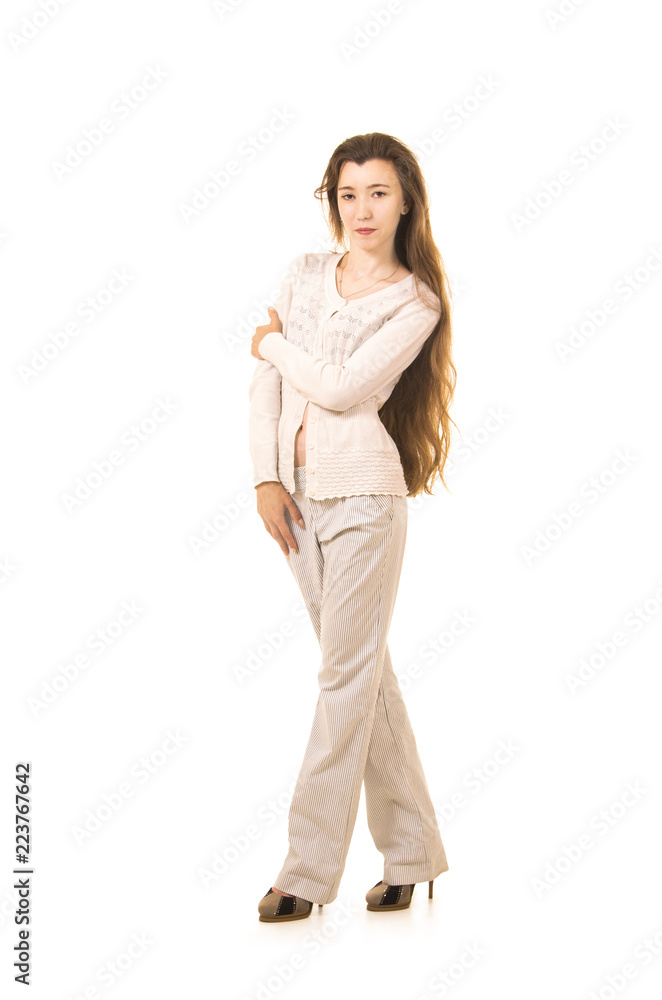 Emotions of a beautiful girl with long hair, in a white jacket posing in Studio on a white background. Emotions of a beautiful girl with long hair, in a white jacket posing in Studio on a white background.