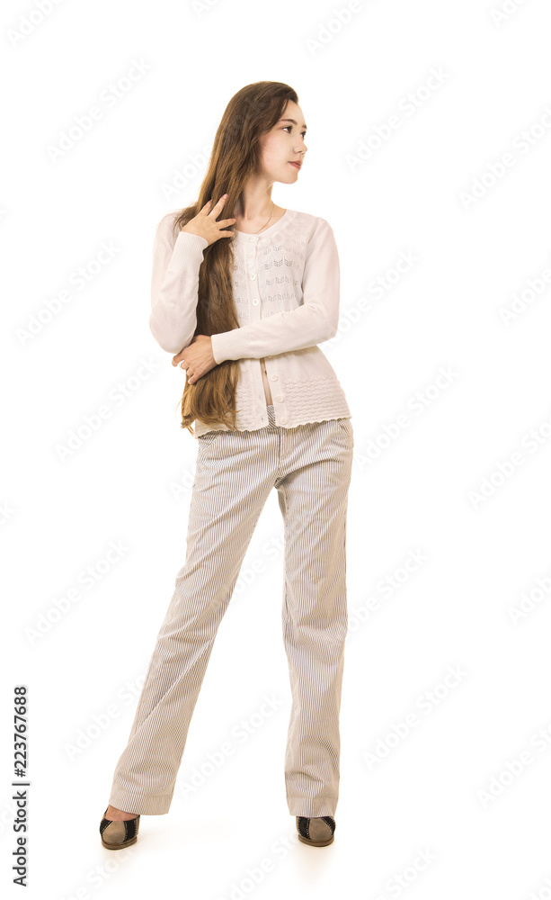 Emotions of a beautiful girl with long hair, in a white jacket posing in Studio on a white background. Emotions of a beautiful girl with long hair, in a white jacket posing in Studio on a white background.