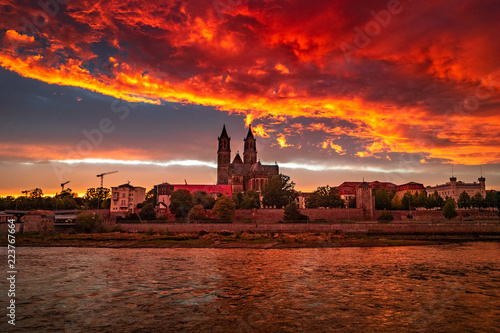 Panoramic view of bloody sunset in front of cathedral in Magdeburg, Germany