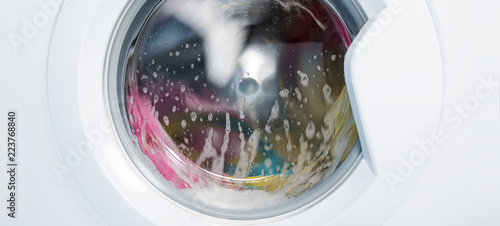 Photography Process of cleaning colour cloth in washing machine, closeup