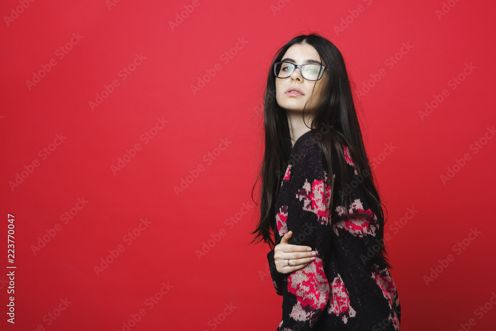 Stylish young woman in sweater and glasses Stylish young woman in sweater and glasses
