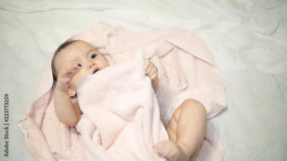 Newborn beautiful baby in towel after bathing Newborn beautiful baby in towel after bathing