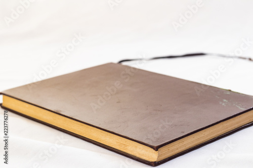 Hard cover books organized over wooden table