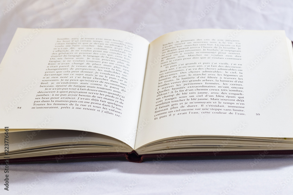 Hard cover books organized over wooden table Hard cover books organized over wooden table