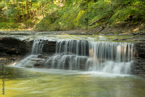 Fototapeta Naklejka Na Ścianę i Meble -  Waterfall on small creek in late summer