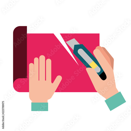 graphic designer hands cutting a paper