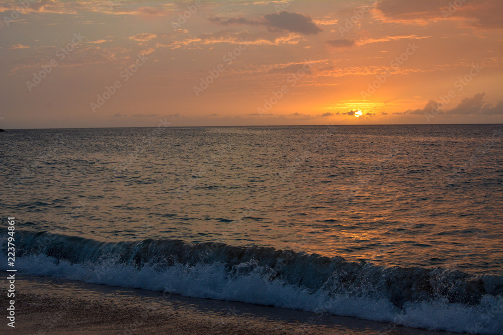 Sunset over Waimea Bay on the north shore of Oahu, Hawaii.