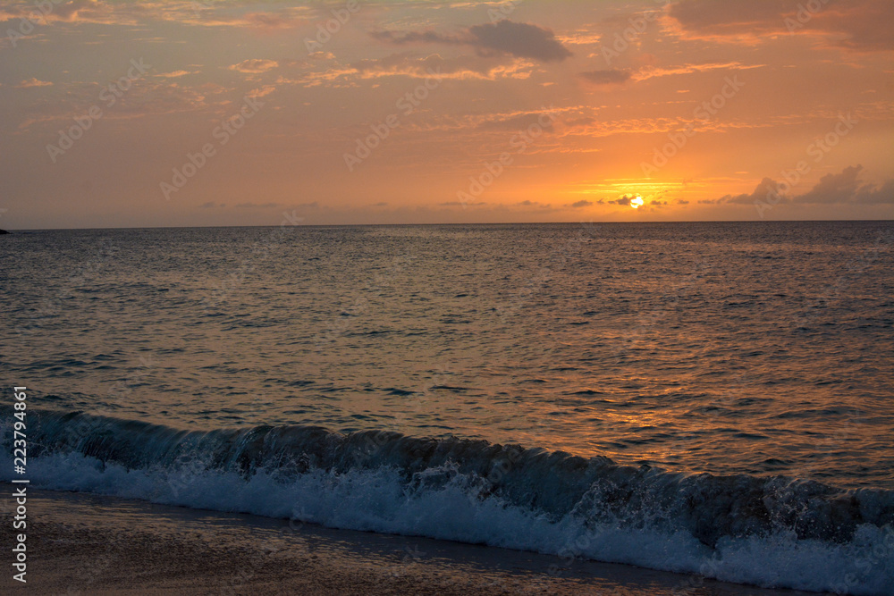 Sunset over Waimea Bay on the north shore of Oahu, Hawaii. Sunset over Waimea Bay on the north shore of Oahu, Hawaii.