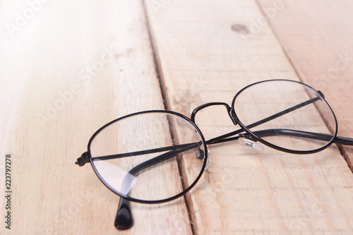 Spectacless Eyeglasses on Wooden Table
