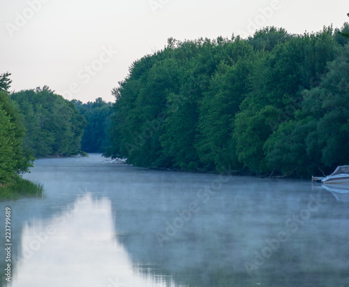 Fototapeta Naklejka Na Ścianę i Meble -  An early morning mist on the Great Chazy River