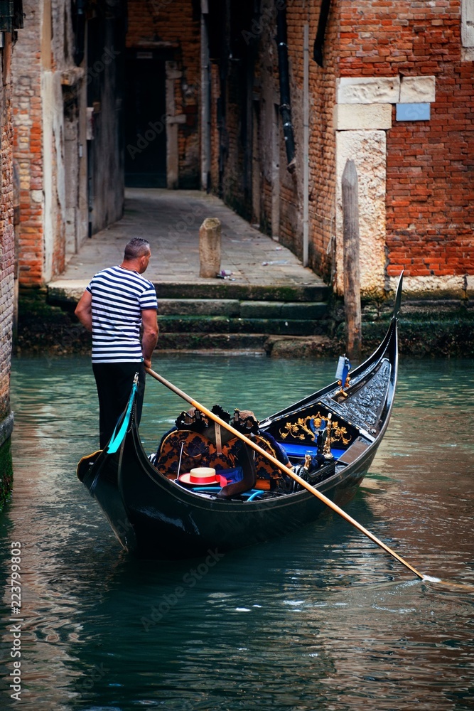 Gondola in canal in Venice
