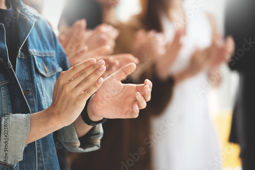 Cropped image of Creative designers audience applauding at a business seminar. photo