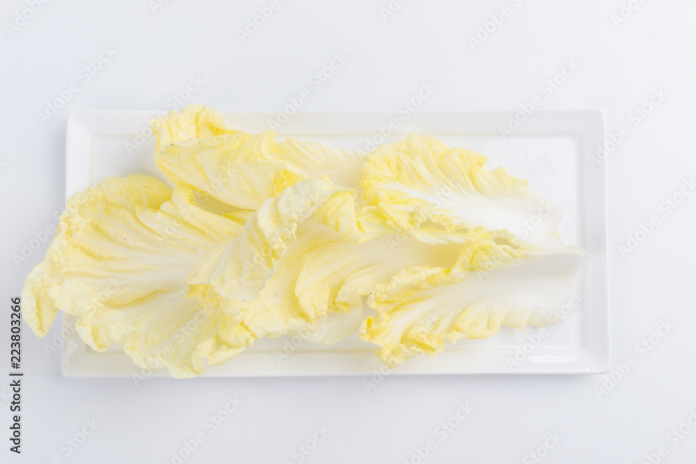 Chinese cabbage in plate on white Chinese cabbage in plate on white