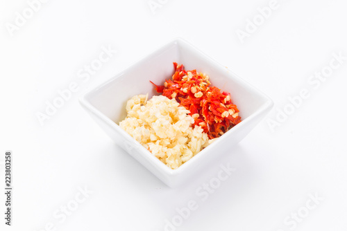 Photos Chopped garlic and chilli in square bowl