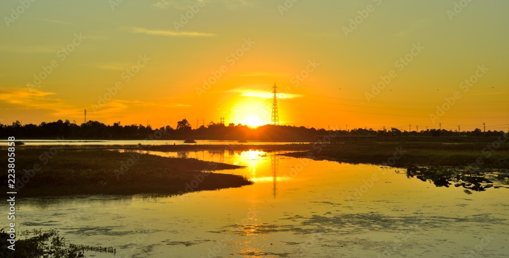 sunset on river in thailand