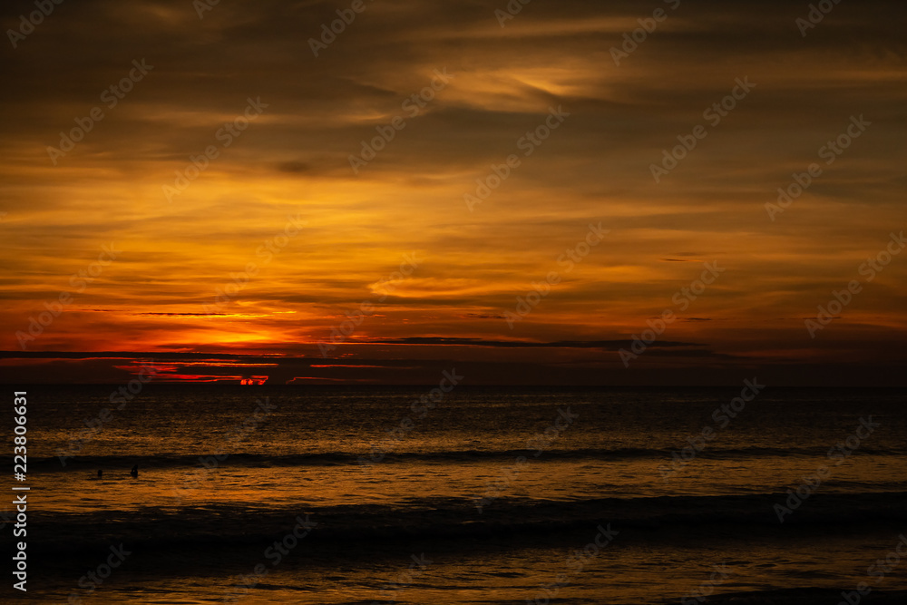 Fototapeta premium Deep and Rich ORange Sunset at Karon Beach