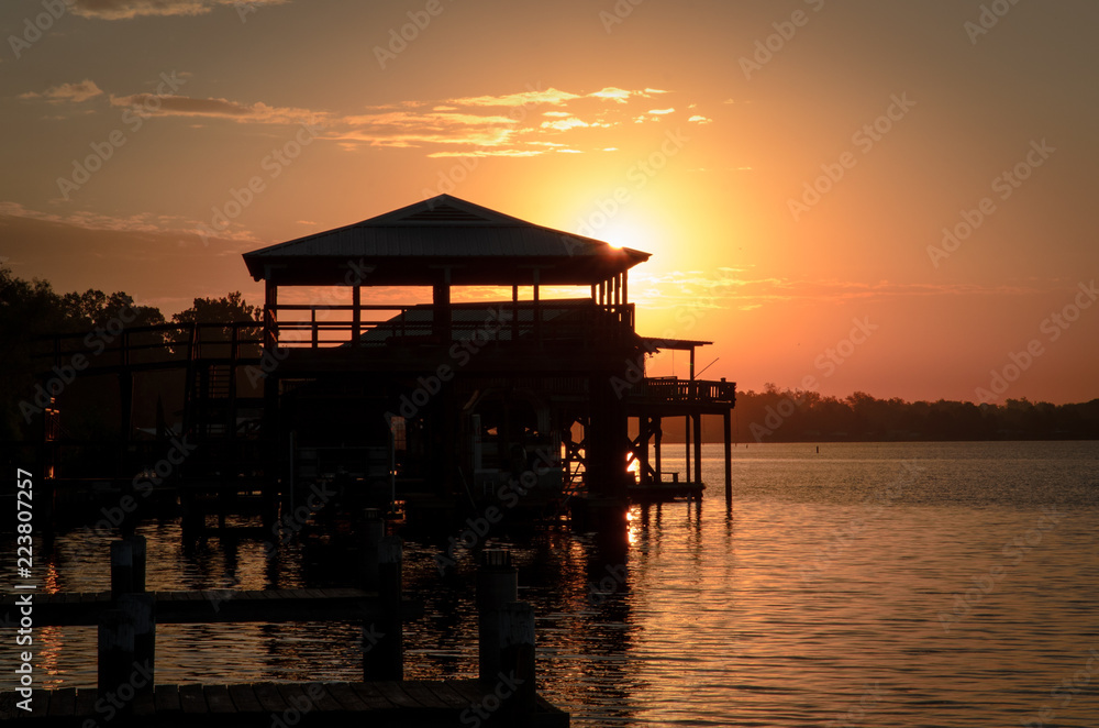 pier and cabana at sunset on the river pier and cabana at sunset on the river