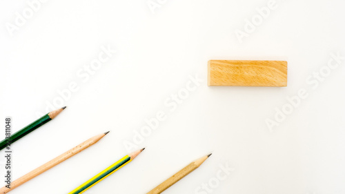 pencil isolated on white background with wooden block copyspace