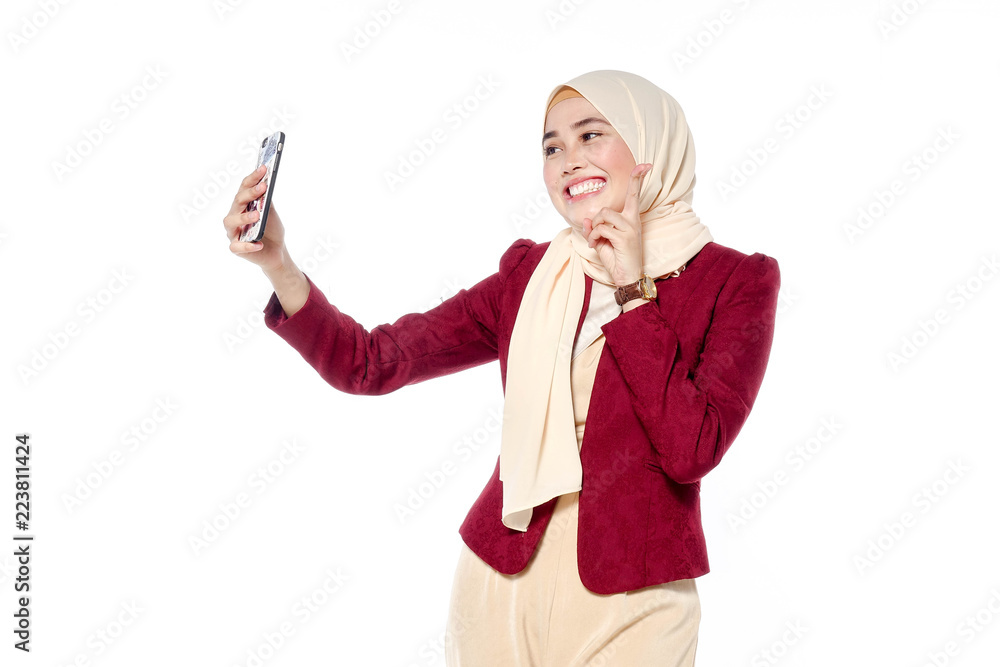 Beautiful young woman taking selfie. Girl photographing herself with phone. Beautiful young woman taking selfie. Girl photographing herself with phone.