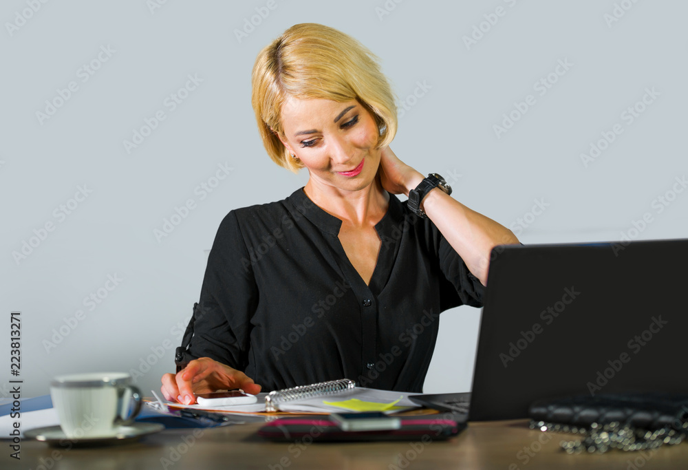 corporate business portrait of young beautiful and happy woman with blonde hair smiling while working relaxed at office laptop computer desk isolated on even background corporate business portrait of young beautiful and happy woman with blonde hair smiling while working relaxed at office laptop computer desk isolated on even background