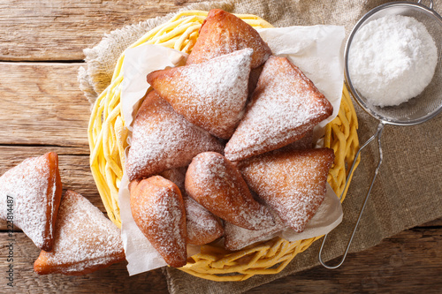 Konstfotografi Mandazi is a slightly sweet East African Street Food; spicy, airy yeast doughnut dough made with coconut milk, flavored with cardamom
