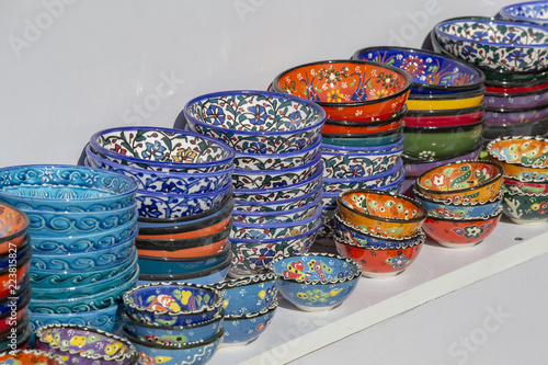 Selling colorful bowls in the shop of traditional Arabian market at Souq Waqif market in Doha, Qatar