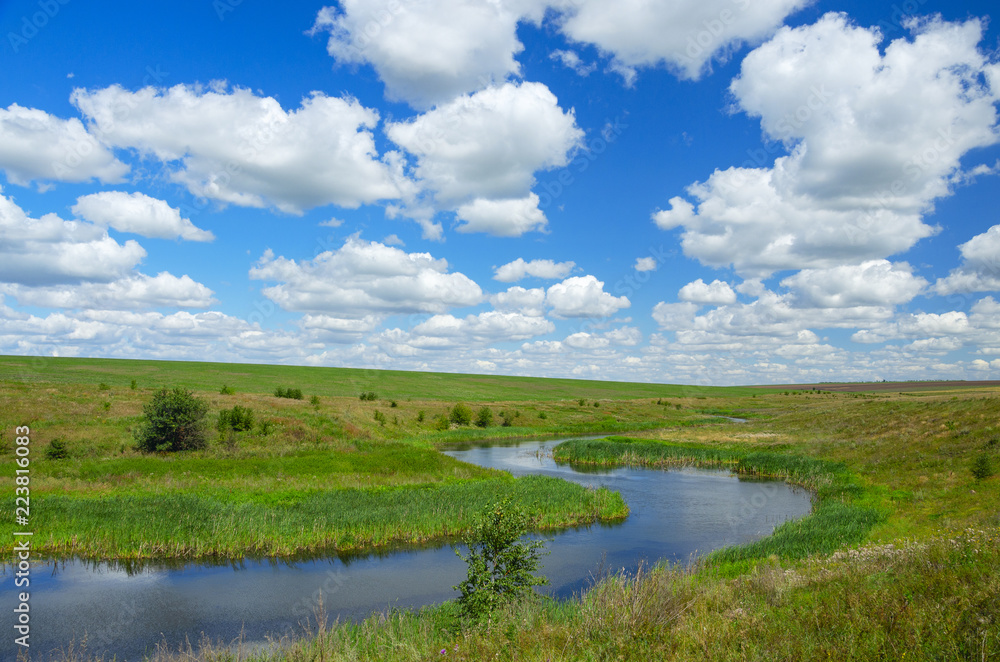 Sunny summer landscape with river curve.Beautiful view of fields,meadows,pastures and woods.Tula region,Russia.