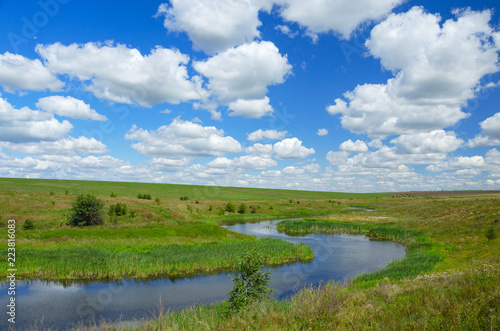 Sunny summer landscape with river curve.Beautiful view of fields,meadows,pastures and woods.Tula region,Russia.