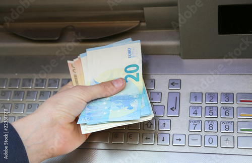 Many Euro banknotes at atm