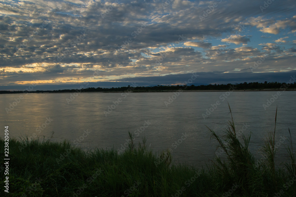 Atmosphere sunset at the Mekong river is bordered by Thailand and Laos