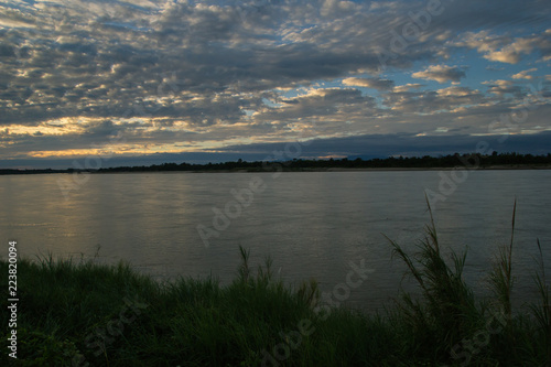 Atmosphere sunset at the Mekong river is bordered by Thailand and Laos