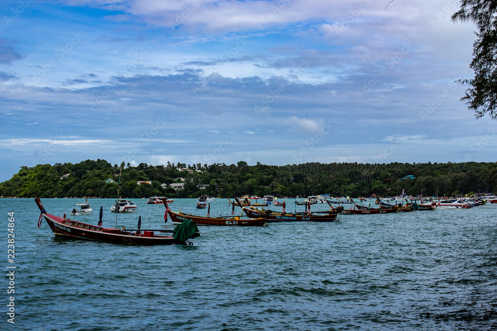 Long boats docked off the coast of Rawaii