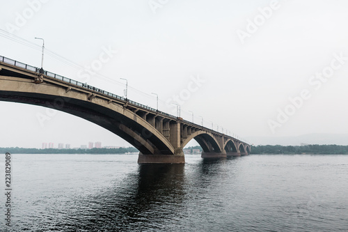 Fototapeta Naklejka Na Ścianę i Meble -  Krasnoyarsk Central bridge over Yenisei river. Modern architecture. Krasnoyarsk region, Russia