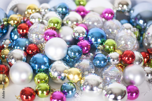Christmas and New Year pattern, ornament of different colors glass decorative balls and tinsel, lights and sparkles, close up © Vera NewSib