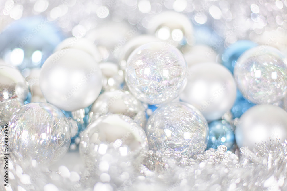 Christmas and New Year pattern, ornament of Christmas balls and tinsel, winter fairytale decor in blue and silver color, lights bokeh close up macro Christmas and New Year pattern, ornament of Christmas balls and tinsel, winter fairytale decor in blue and silver color, lights bokeh close up macro