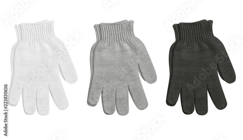 set of knitted winter gloves, black, gray, white, isolated on white background, close-up, mens gloves photo