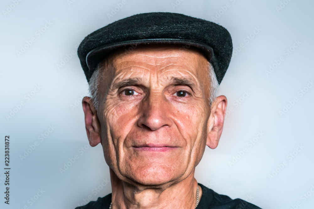 Close-up of a man wearing a cap Close-up of a man wearing a cap