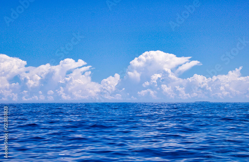 beautiful white clouds over the sea in similar shape © raffaellagalvani