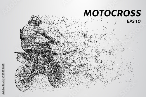 Motocross particles. A motorcyclist performs stunts