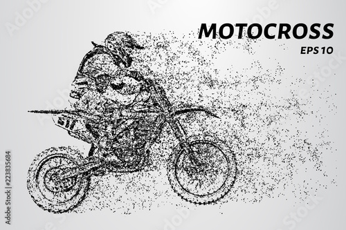 Motocross particles. A motorcyclist performs stunts