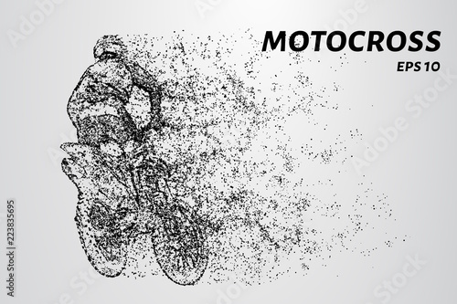 Motocross particles. A motorcyclist performs stunts