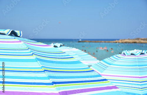 Sun umbrellas in the Fig Tree bay, Cyprus