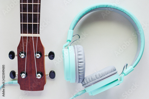 Ukulele with green headphon...