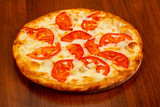 Pizza with chicken and tomato