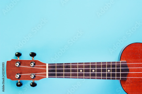 Ukulele on blue background ...