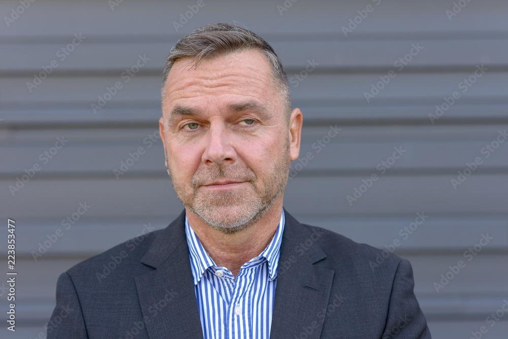 Unimpressed businessman with a weary expression