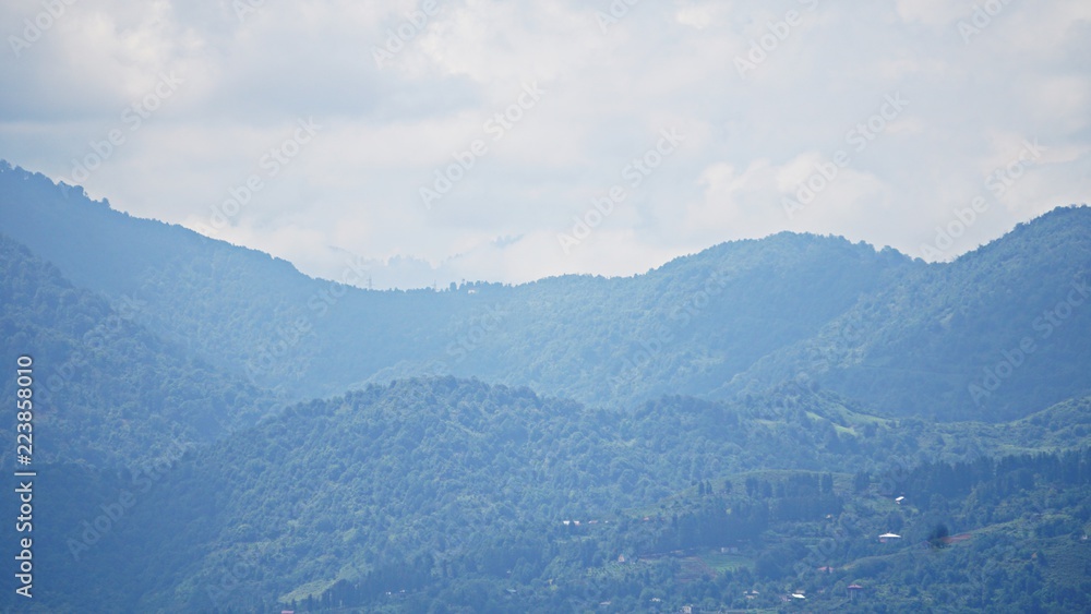Mountain peak range landscape. Green mountain range view. Mountain peak blue sky white clouds panorama