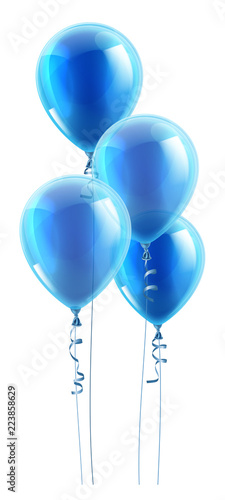 A set of blue party balloons floating in the air.
