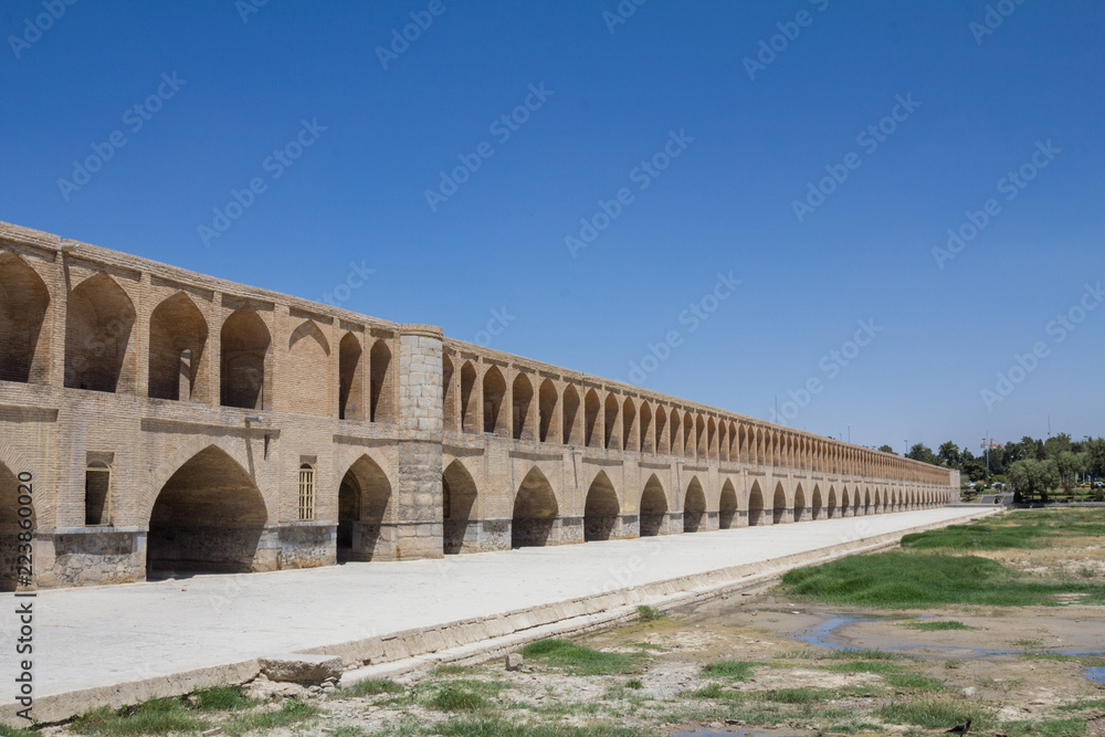 Si o Seh Pol bridge on the afternoon in Isfahan, Iran. Also known as Allahverdi Khan Bridge, or 33 arches bridge, it is a major landmark of the city and a symbol of the Persian Safavid Architecture