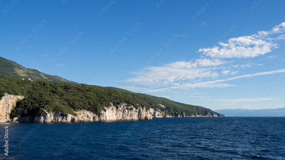 Coastline and cloudy sky